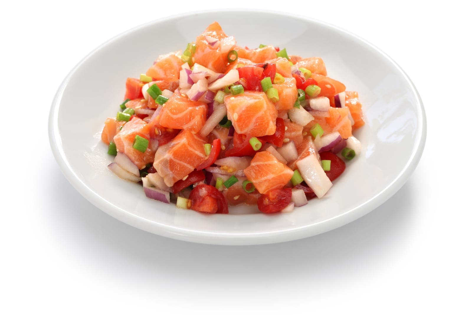 A bowl of lomi salmon — cured salmon worked together with diced tomato, sweet onion, and scallion, served cold
